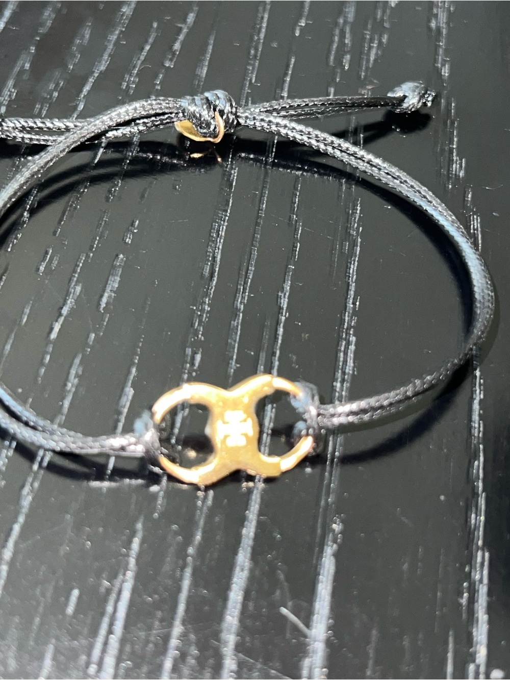 Elegant Black Cord Bracelet with Gold Accent